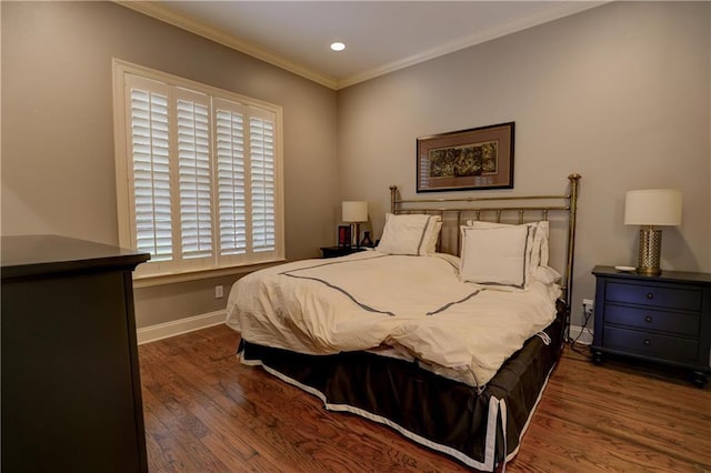 bedroom featuring ornamental molding, dark hardwood / wood-style flooring, and multiple windows