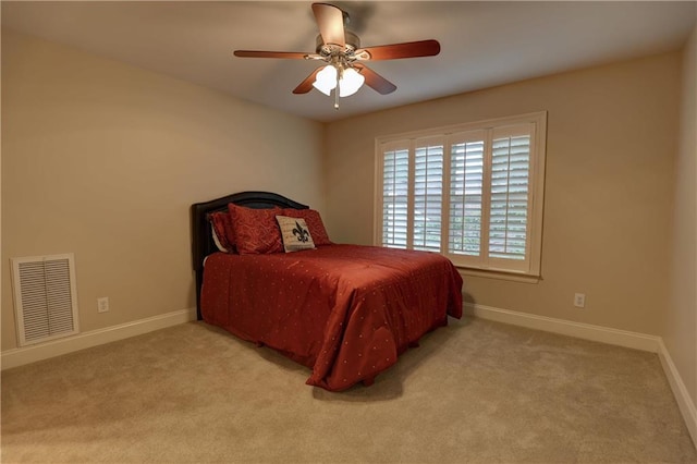 bedroom featuring light carpet and ceiling fan