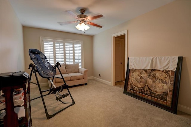 exercise area with light carpet and ceiling fan