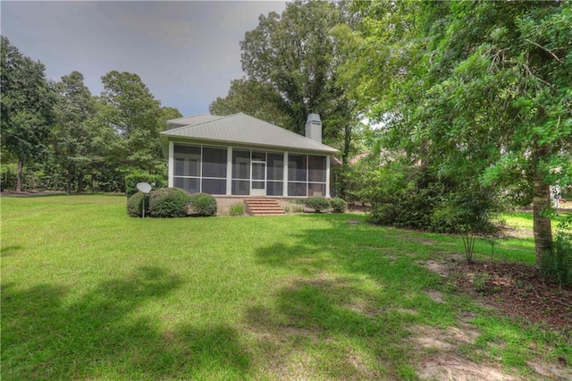 view of yard with a sunroom