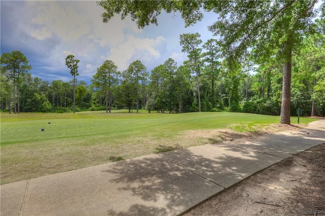 surrounding community featuring a lawn