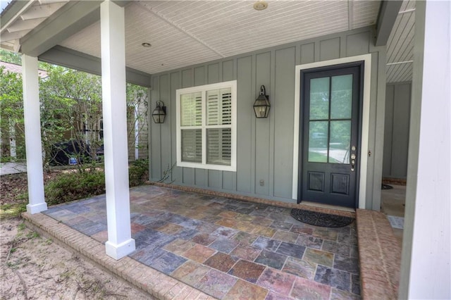 entrance to property featuring a patio