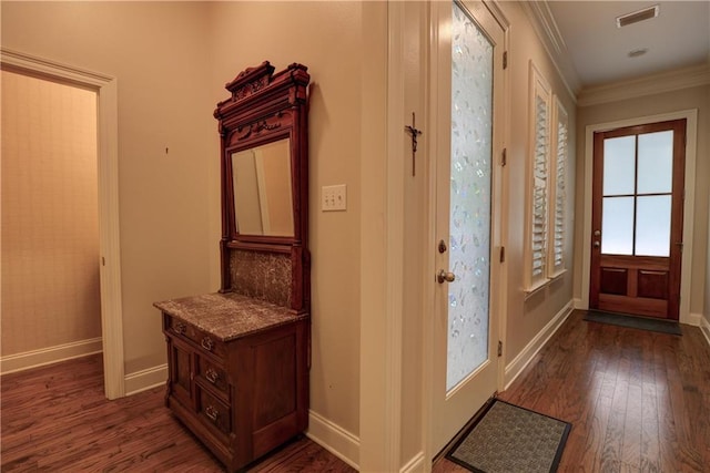 doorway to outside with crown molding and dark wood-type flooring