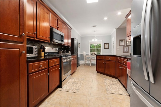 9486 Labrador Run N, Mobile, AL 36695 - kitchen with stainless steel appliances, a peninsula, backsplash, crown molding, and light tile patterned flooring