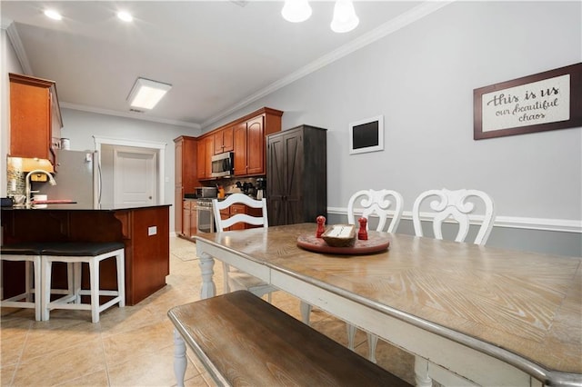 9486 Labrador Run N, Mobile, AL 36695 - dining area featuring crown molding and light tile patterned flooring