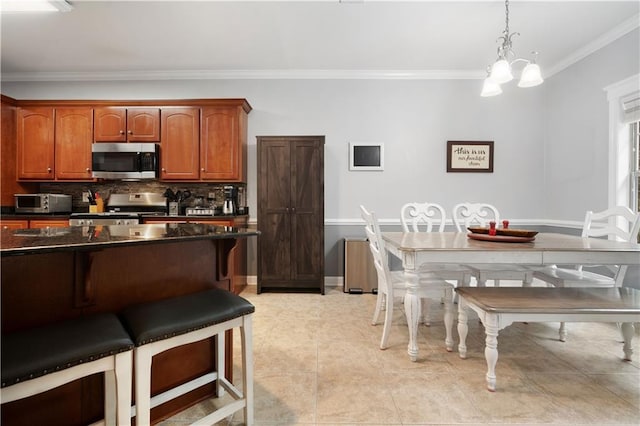 9486 Labrador Run N, Mobile, AL 36695 - kitchen with appliances with stainless steel finishes, ornamental molding, a breakfast bar, dark countertops, and backsplash