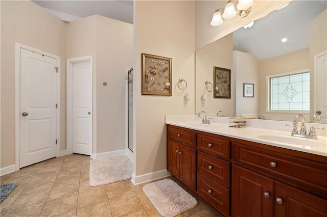 9486 Labrador Run N, Mobile, AL 36695 - bathroom with double vanity, tile patterned flooring, baseboards, and an enclosed shower