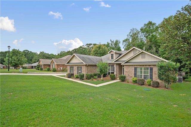 9486 Labrador Run N, Mobile, AL 36695 - view of front of property with brick siding, a front yard, and central air condition unit