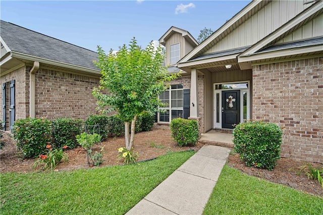 9486 Labrador Run N, Mobile, AL 36695 - entrance to property with brick siding, roof with shingles, and a yard