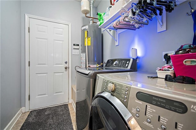 9486 Labrador Run N, Mobile, AL 36695 - laundry area featuring independent washer and dryer, water heater, baseboards, and tile patterned floors