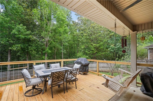 9486 Labrador Run N, Mobile, AL 36695 - wooden deck with outdoor dining space and a grill