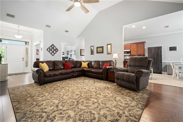 9486 Labrador Run N, Mobile, AL 36695 - living room with a ceiling fan, light wood-type flooring, crown molding, high vaulted ceiling, and baseboards
