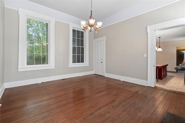 255 N Conception St, Mobile, AL 36603 - unfurnished room featuring hardwood / wood-style floors and a chandelier