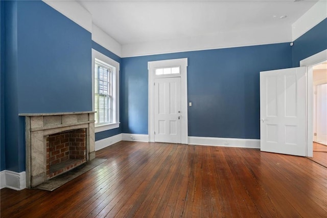 255 N Conception St, Mobile, AL 36603 - unfurnished living room featuring hardwood / wood-style floors, plenty of natural light, and a fireplace