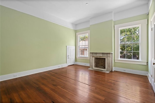 255 N Conception St, Mobile, AL 36603 - unfurnished living room featuring a high end fireplace and hardwood / wood-style flooring