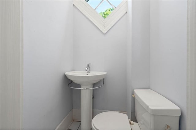 255 N Conception St, Mobile, AL 36603 - half bathroom featuring toilet and tile patterned floors