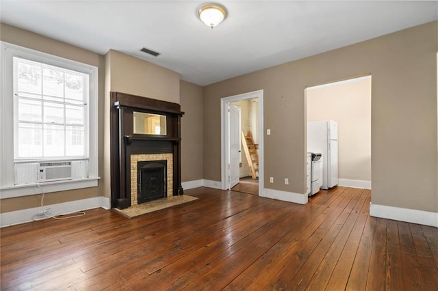 255 N Conception St, Mobile, AL 36603 - unfurnished living room featuring stairs, hardwood / wood-style flooring, and a fireplace