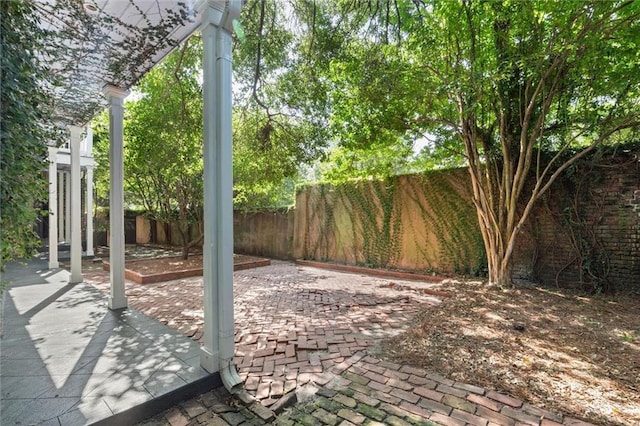 255 N Conception St, Mobile, AL 36603 - fenced backyard featuring a patio area