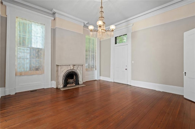 255 N Conception St, Mobile, AL 36603 - unfurnished living room with ornamental molding, a chandelier, hardwood / wood-style flooring, and a fireplace with flush hearth