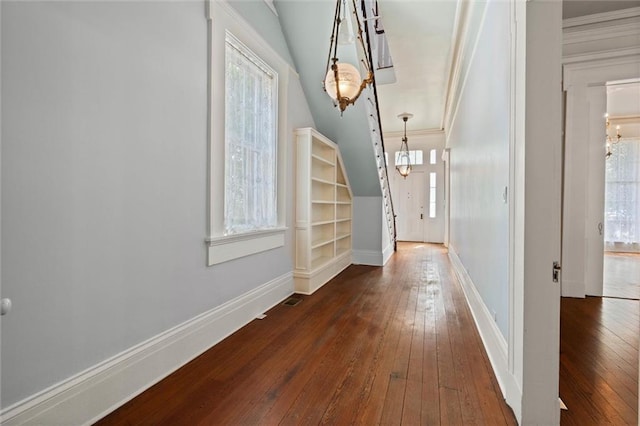 255 N Conception St, Mobile, AL 36603 - foyer entrance featuring dark wood-type flooring, a chandelier, healthy amount of natural light, crown molding, and vaulted ceiling