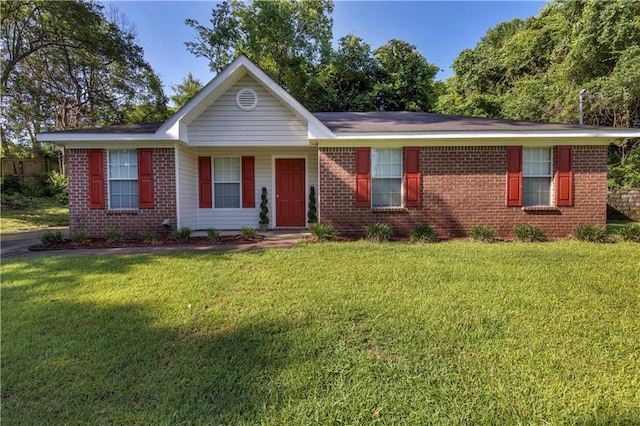 2647 Weems Dr, Mobile, AL 36607 - ranch-style house with brick siding and a front lawn