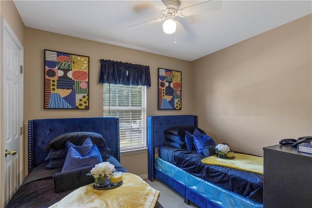 2647 Weems Dr, Mobile, AL 36607 - carpeted bedroom with ceiling fan and baseboards