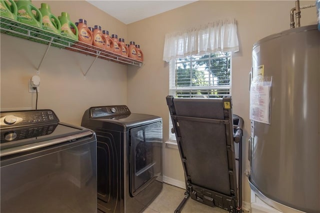 2647 Weems Dr, Mobile, AL 36607 - laundry room with water heater, washing machine and dryer, and light tile patterned floors