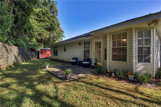 2647 Weems Dr, Mobile, AL 36607 - view of yard with a patio and a storage unit