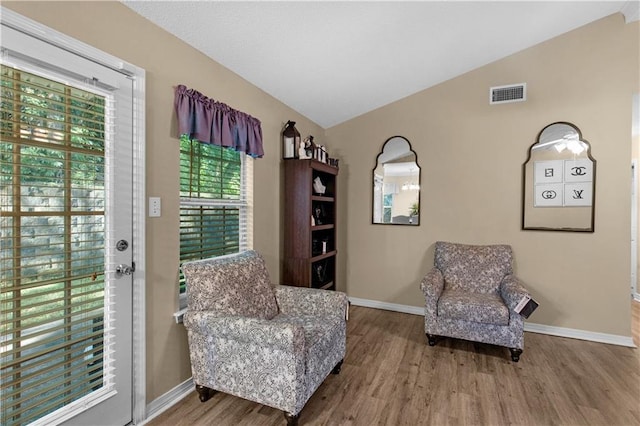2647 Weems Dr, Mobile, AL 36607 - living area with vaulted ceiling and wood finished floors