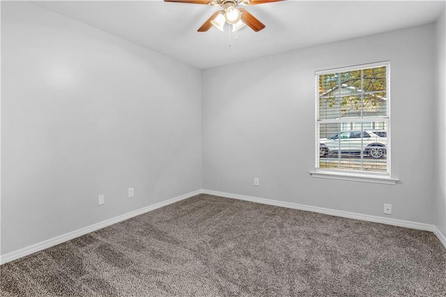 unfurnished room featuring ceiling fan and carpet floors