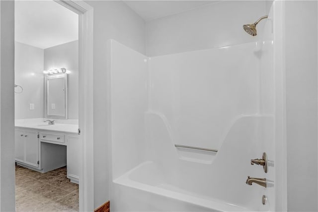 bathroom featuring shower / bathing tub combination, vanity, and tile patterned flooring