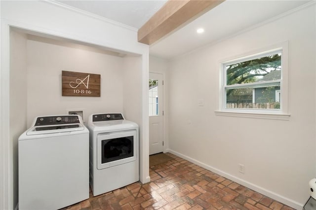 clothes washing area with crown molding, baseboards, laundry area, brick floor, and independent washer and dryer