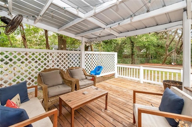 wooden deck with an outdoor living space