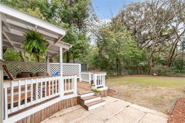 view of yard with a deck and fence