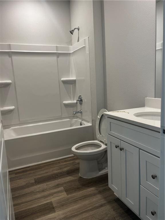 7324 Hawkins Mnr N, Mobile, AL 36695 - bathroom with vanity, toilet, tub / shower combination, and wood finished floors