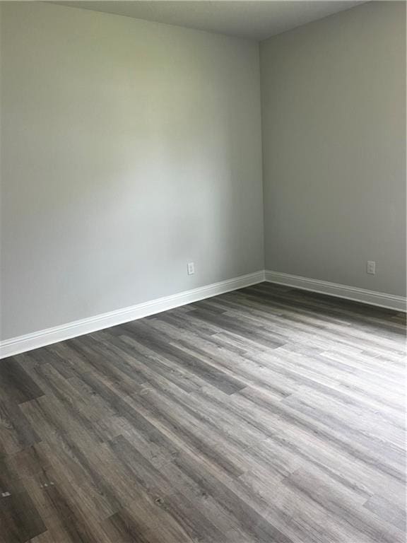 7324 Hawkins Mnr N, Mobile, AL 36695 - empty room with dark wood finished floors and baseboards