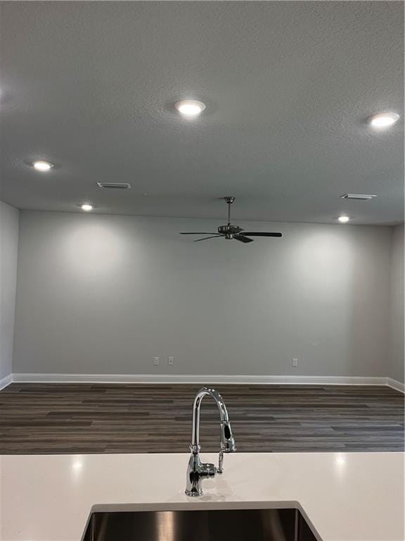 7324 Hawkins Mnr N, Mobile, AL 36695 - kitchen with recessed lighting, wood finished floors, light countertops, a ceiling fan, and a textured ceiling