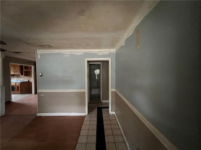 hall featuring tile patterned flooring