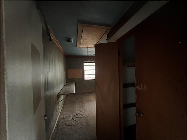 hallway with wooden walls