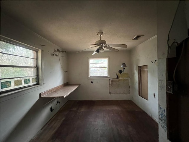 laundry room featuring hardwood / wood-style flooring and ceiling fan