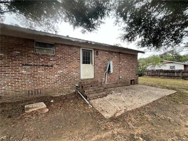 rear view of property featuring a patio