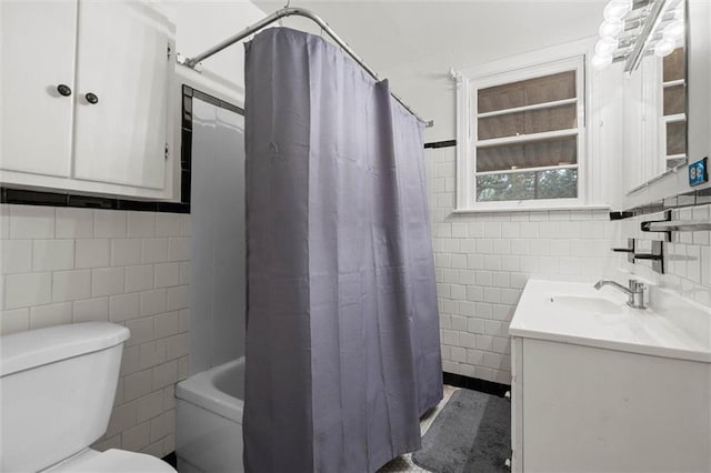 4615 Sunset Dr N, Mobile, AL 36608 - bathroom with tile walls, vanity, toilet, and shower / tub combo with curtain