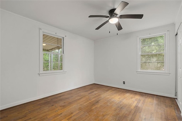 4615 Sunset Dr N, Mobile, AL 36608 - empty room with wood-type flooring, ornamental molding, plenty of natural light, and baseboards