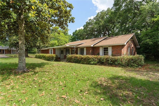 4615 Sunset Dr N, Mobile, AL 36608 - ranch-style home with a front yard and brick siding