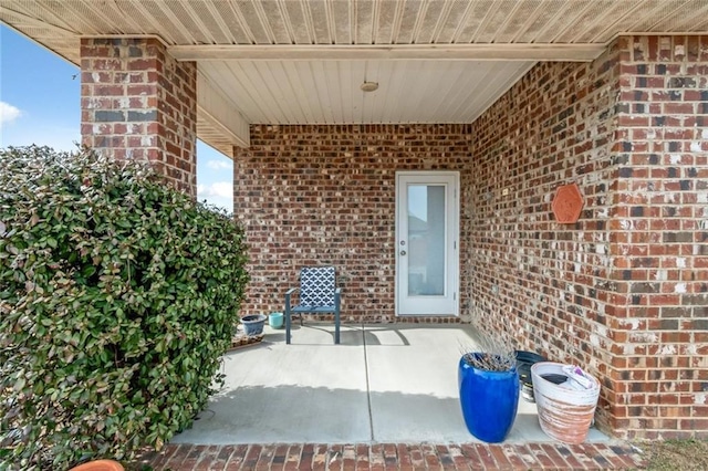 entrance to property with a patio