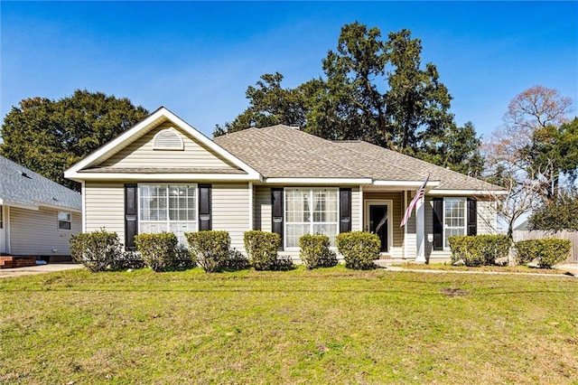 single story home featuring a front yard