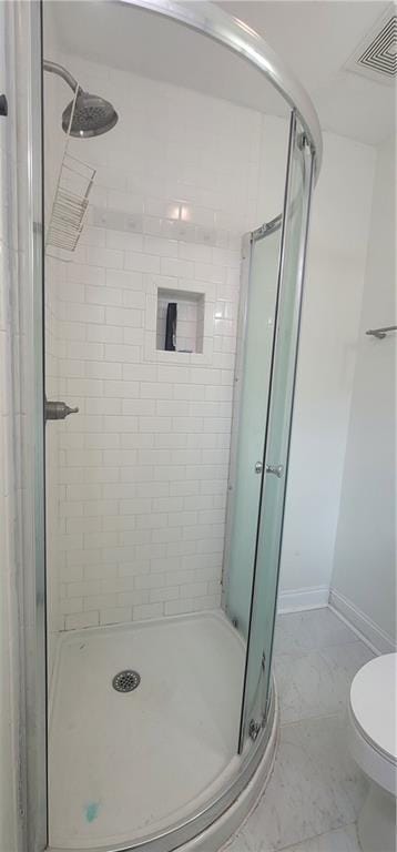 11150 Lakeside Cir, Grand Bay, AL 36541 - bathroom with a stall shower and marble look tiles