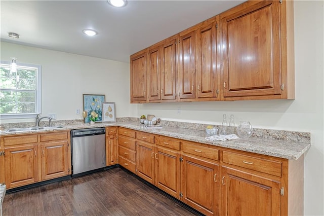 kitchen featuring dishwasher, decorative light fixtures, light stone counters, sink, and dark wood-type flooring