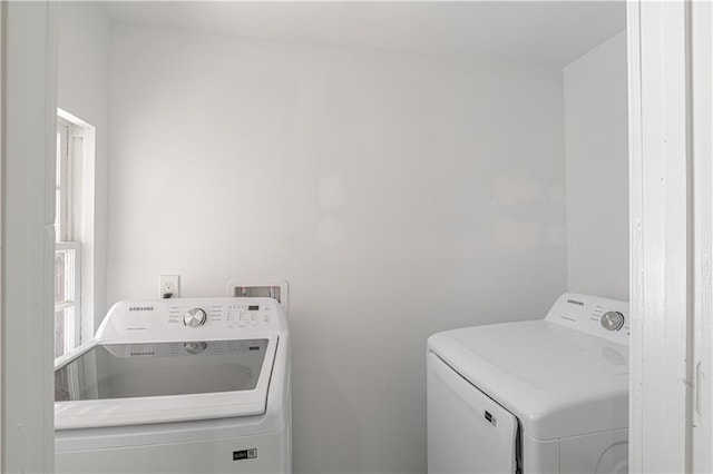 washroom featuring washing machine and dryer