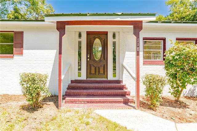 doorway to property featuring a porch